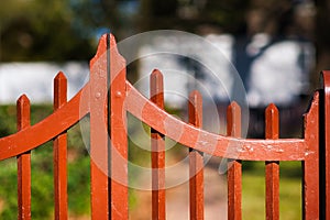 A decorative wooden gate into a garden.