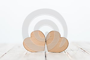 Decorative wooden hearts symbols on white