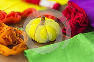 Decorative yelllow pumpkin made from felt