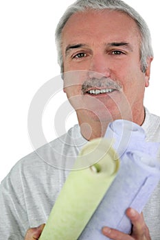 Decorator holding wallpaper