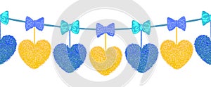 Decortive elements with pom-poms in the shape of a heart and bows