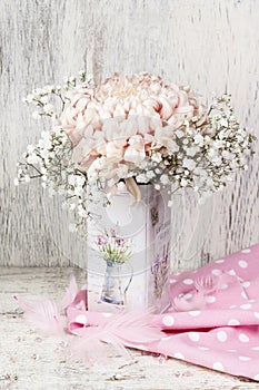 Decoupage decorated can with flowers