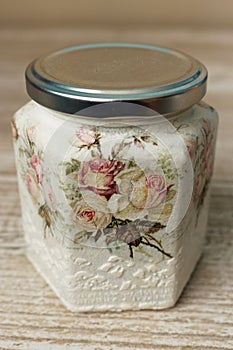 Decoupage decorated closed vintage jar