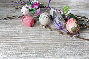 Decoupage decorated colorful Easter eggs with willow branches