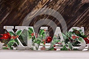 Decoupage decorated XMAS letters on wooden background