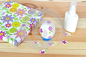 Decoupage Easter egg, glue, napkins with a floral pattern on a natural wooden background. Hand made paper craft. Step