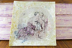Decoupage made painting with childhood symbols