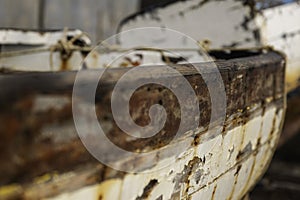 Decrepit old row boats in the harbor in Naples