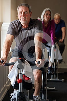 Dedicate to fitness no matter your age. a group of seniors having a spinning class at the gym.