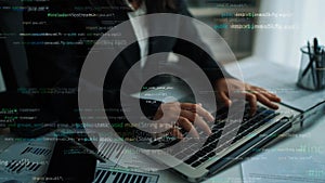 Professional Developer Working on Laptop with Programming Code Overlay in Modern Office Environment Focused on Software