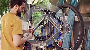 Dedicated people reparing modern bicycle