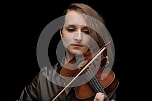 Dedicated woman playing a Baroque violin