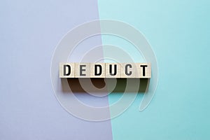 Deduct word concept on cubes photo