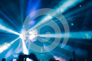 Deejay on a stage with disco ball with rays background