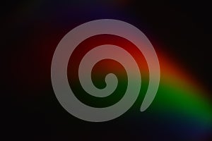 Deep abstract rainbow arc emerging from darkness