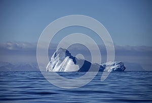 Deep blue ancient glacial iceberg under the midnight sun,  Antarctica