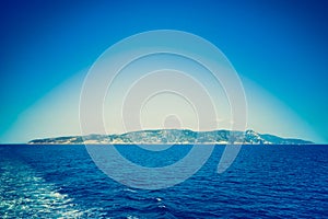 Deep blue filtered vignetted panorama view of Argentario photo