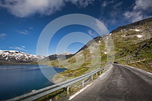 Deep blue lake Djupvatnet with road in Norway