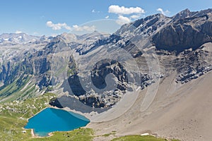 deep blue lake Iffigsee near Lenk on a sunny day with blue sky