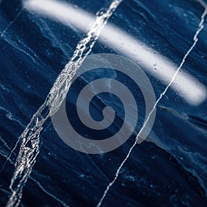 Deep blue marble texture with white veining and light reflection