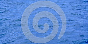 Deep blue rippling water surface