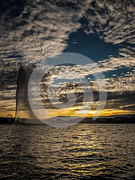 Unique circular cloud pattern over the harbour of Geneva, Switzerland.