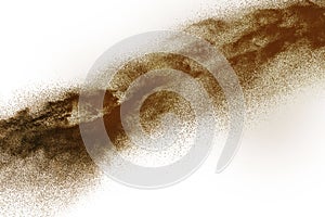 Deep Brown particles splattered on white background.