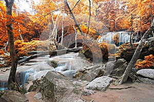 Deep forest waterfall in autumn scene at Erawan waterfall Nation