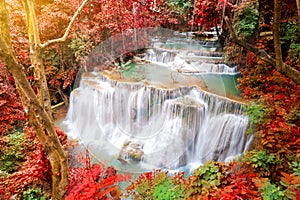 Deep forest waterfall in autumn scene at Huay Mae Kamin waterfall National Park Kanjanaburi Thailand photo