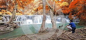 Deep forest waterfall in autumn scene at Huay Mae Kamin waterfall photo