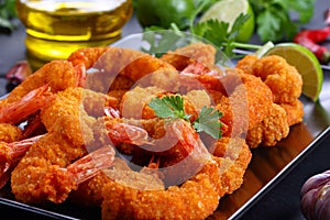 Deep fried breaded shrimps on plate