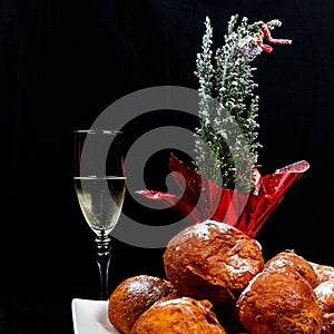 Deep fried buns oliebol and a glass of champagne is a typical Dutch tradition to celebrate new years eve in the Netherlands