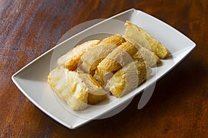 Deep fried cassava root . Brazilian Mandioca Frita (deep fried cassava/ manioc/yuca). Feijoada side dish