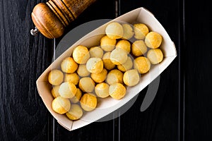 Deep fried cheese and potato balls on the black background photo