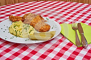 Deep fried chicken escalope or schnitzel with mashed potatoes.