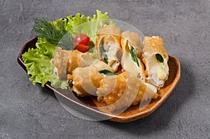 Deep-fried chicken, mozzarella and green onion rolls