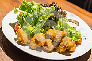 Deep fried chicken with salad