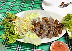 deep fried chicken tendon with chili sauce.