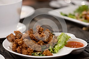 Deep fried chicken tendons with chili sauce