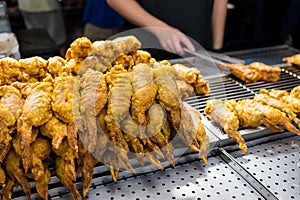 Deep fried chicken wing in street market