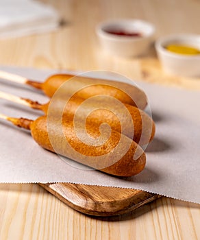 Deep Fried Corn Dogs on Parchment Paper