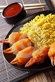 Deep fried crab claws in breadcrumbs of surimi with spicy yellow