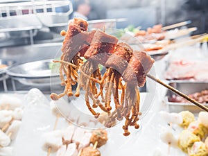 Deep fried crispy Bacon and Enoki Mushroom on stick in Lok Lok c