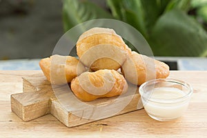 Deep fried dough bun with sweetened condensed milk