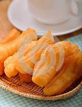 Deep fried dough stick on white background