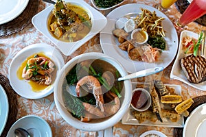 Deep-fried eggplant, Tuna Steak and Steamed Shrimp dishes on the table