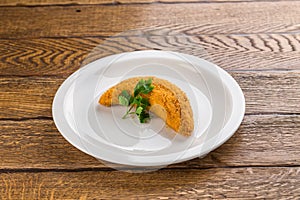Deep fried fish in batter isolated on wooden background