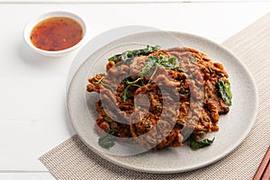 Deep fried fish patty or Thai Fish cake with crispy basil