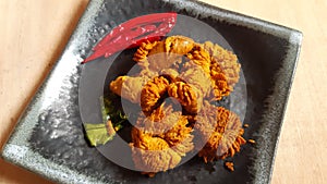 Deep fried fish roe or fish eggs in plate.