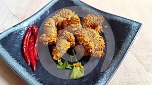 Deep fried fish roe or fish eggs in plate.